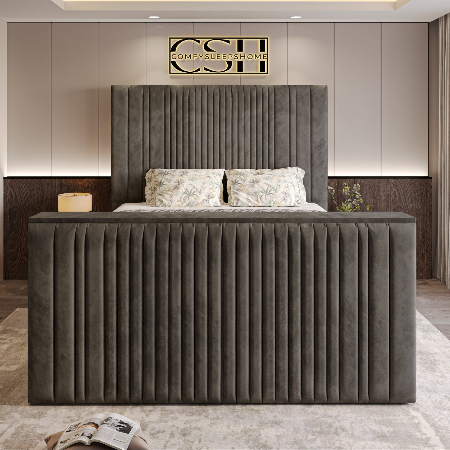 Modern bedroom with the 2025 Belgravia TV Bed, showcasing a built-in TV, plush bedding, sleek grey design, and warm lighting.
