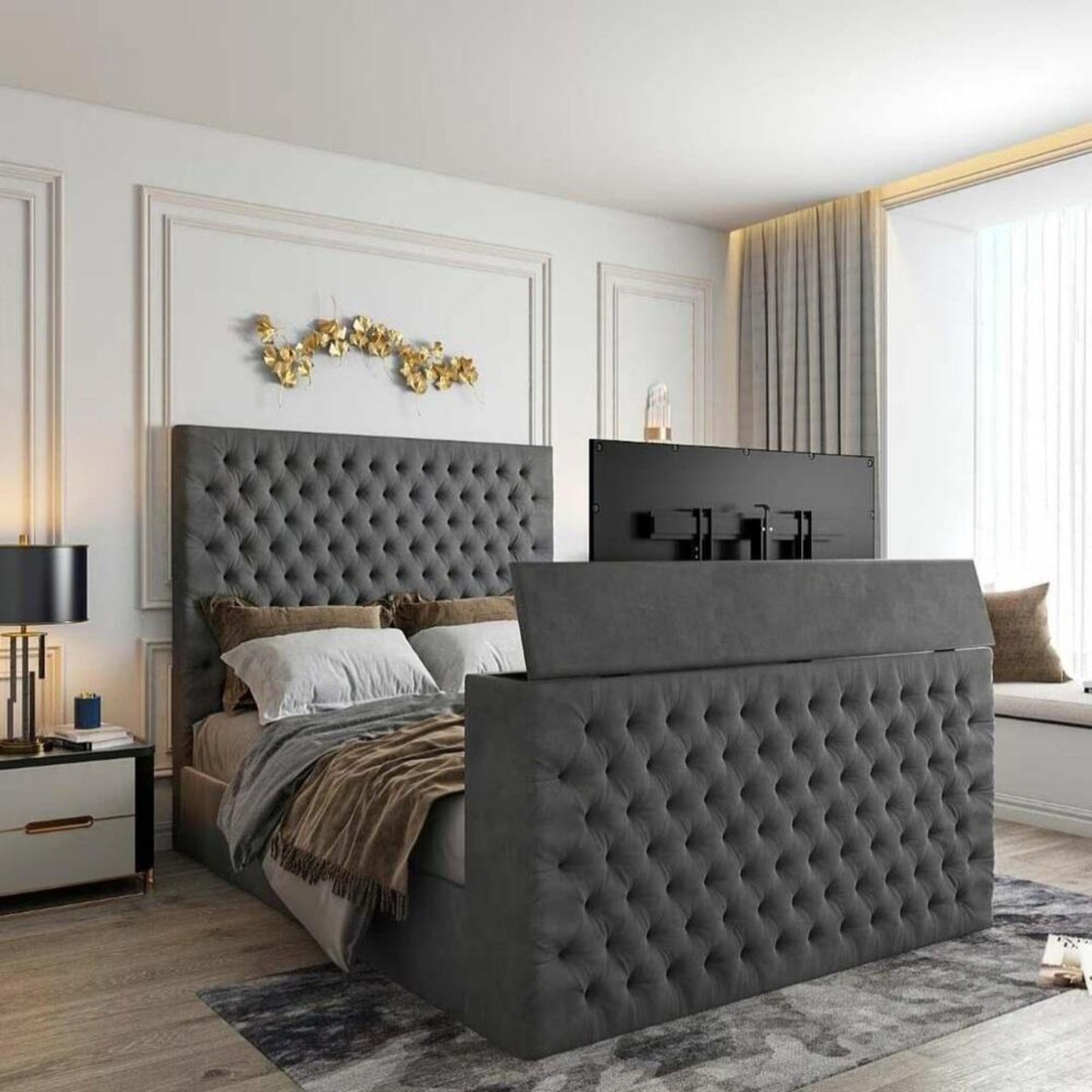 Modern bedroom with a 2025 Florence TV bed, gray tufted headboard, integrated TV, and elegant decor elements.