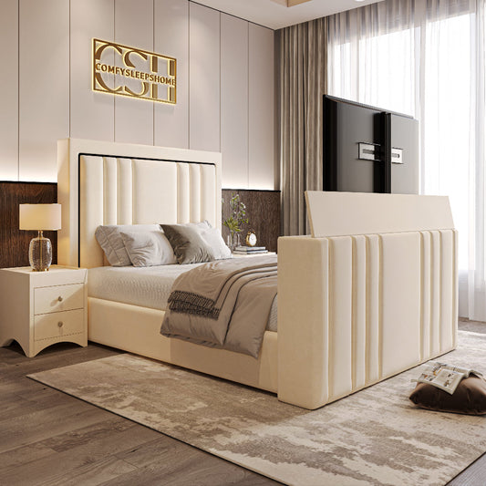 A sophisticated cream 2025 Kensington TV Bed with a panelled headboard and integrated TV, set in a modern bedroom with a large window.