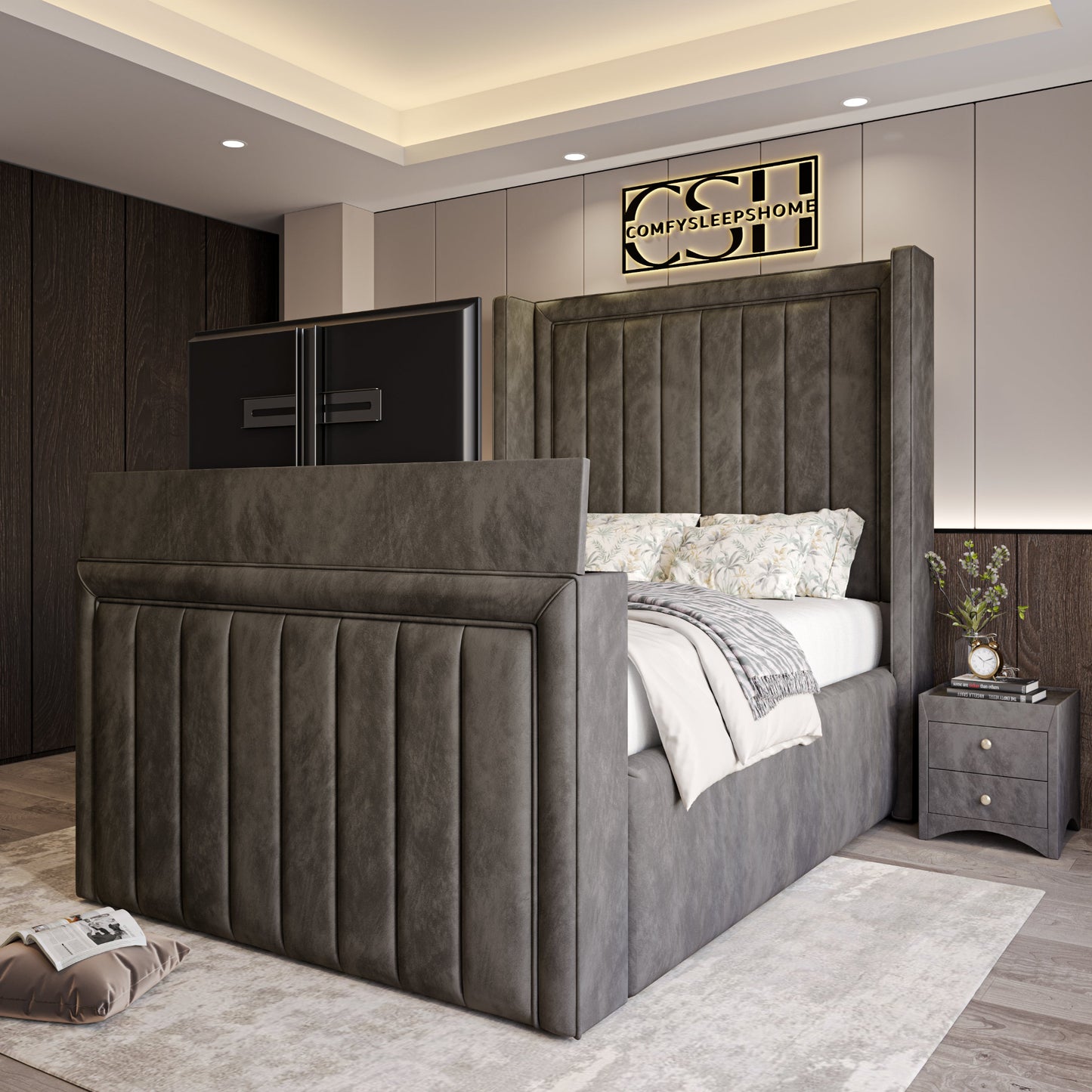 Modern bedroom featuring a plush, grey upholstered bed with built-in TV. The 2025 The Astoria TV Bed is the room's centerpiece.