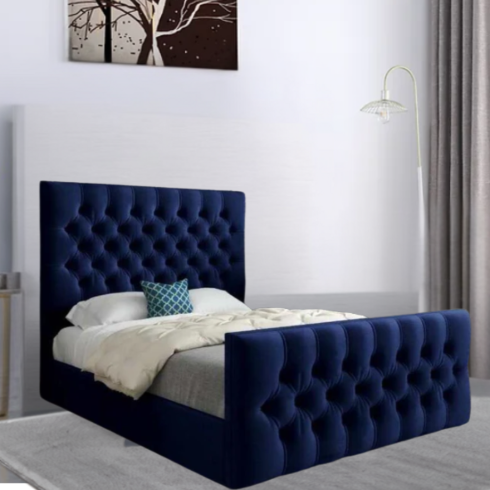 Blue tufted bed in a modern bedroom with a standing lamp and gray curtain.