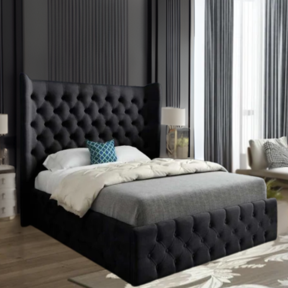 Bedroom with a dark tufted bed, large windows, and modern furnishings.