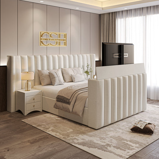 Modern bedroom with padded bed, neutral decor, and a TV at the foot of the bed.