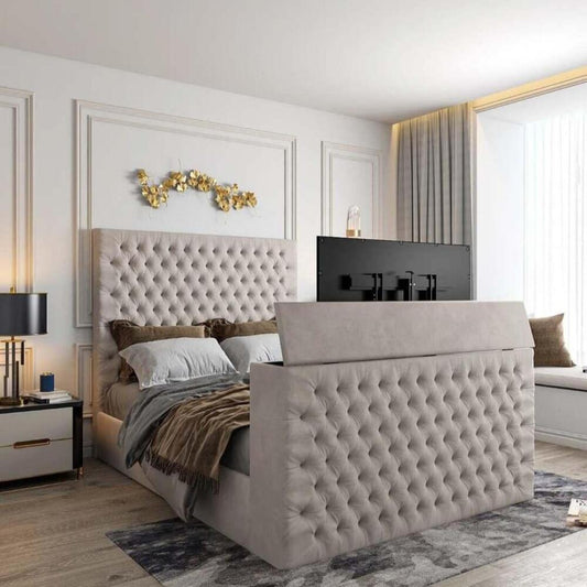 Contemporary bedroom with a tufted bed, built-in TV in footboard, 2025 florence tv bed, wall art, and a window seat, lit by natural light.