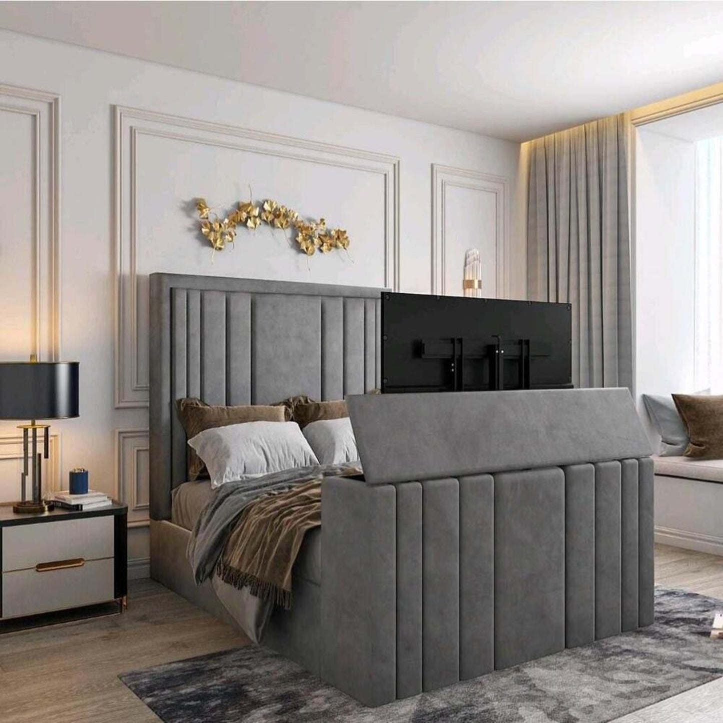 A bedroom with a 2025 lily TV bed, showcasing a gray upholstered headboard and footboard with a concealed TV, elegant décor.