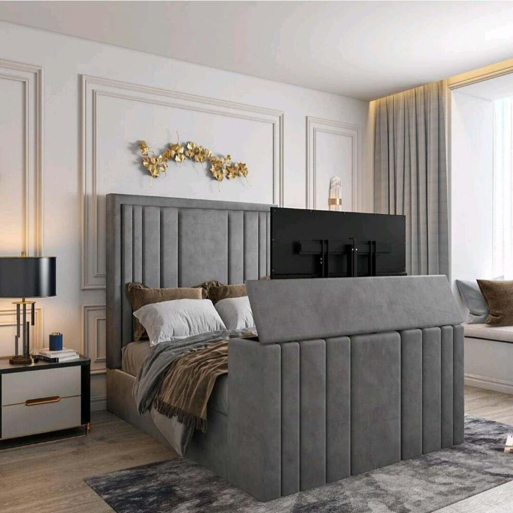 A bedroom with a 2025 lily TV bed, showcasing a gray upholstered headboard and footboard with a concealed TV, elegant décor.