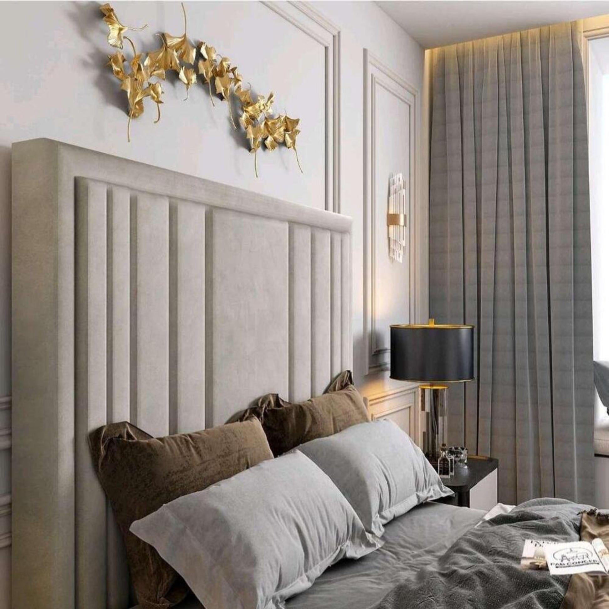 Modern bedroom with 2025 lily TV bed, featuring a light gray paneled headboard, gold wall decor, and gray curtains.