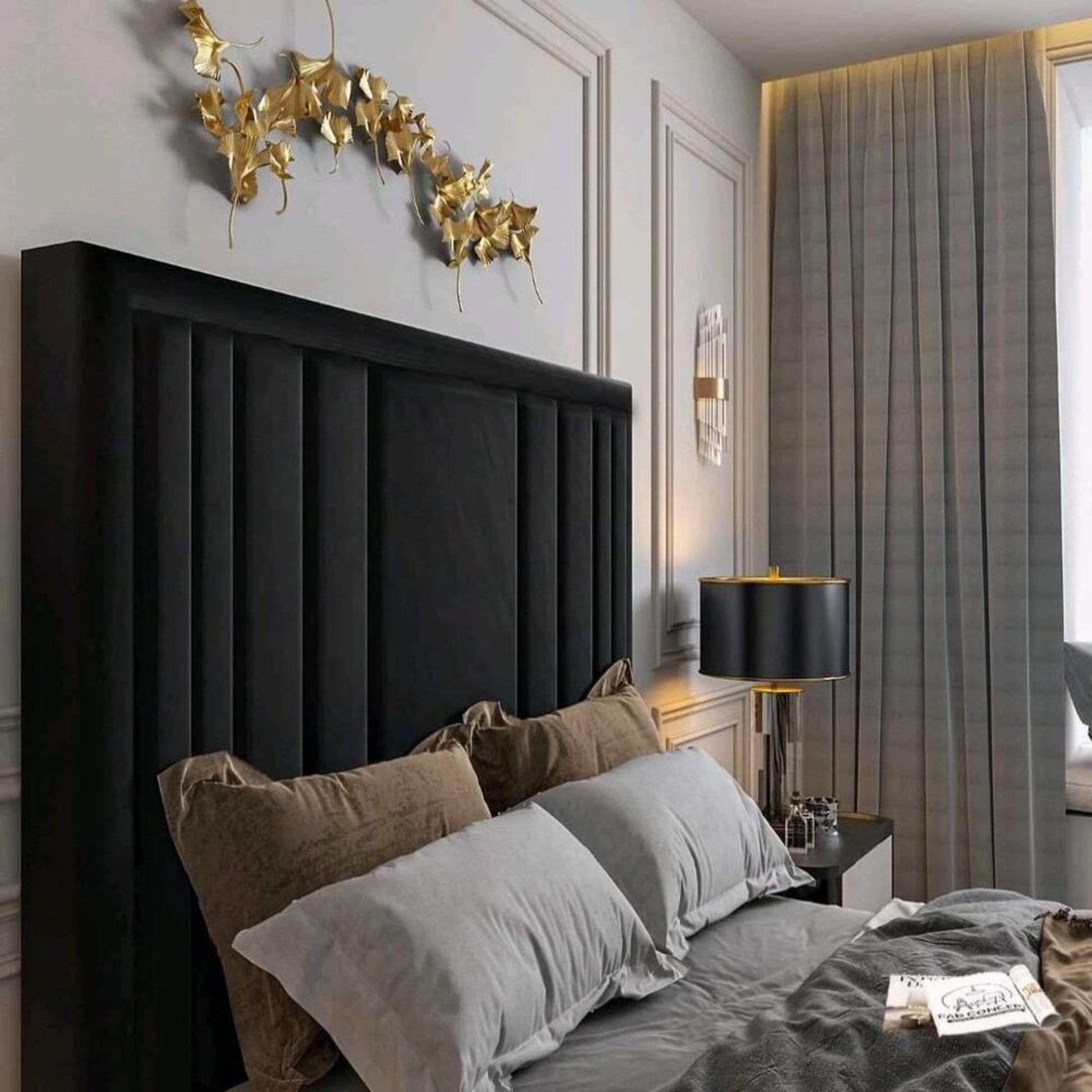 Modern bedroom with a black headboard, gold wall art, and gray curtains next to a 2025 lily tv bed featuring elegant bedding.