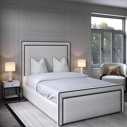 Modern bedroom with a linear bed, gray walls, and a window view of greenery.