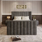Modern bedroom with 2025 Lynza TV Bed, featuring dark upholstery and minimalist decor.