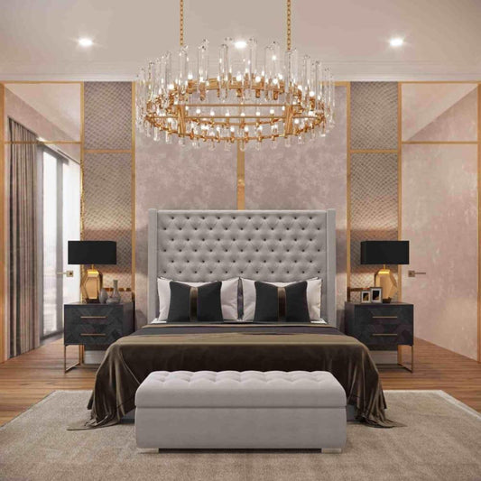 Elegant bedroom with 2025 Nina wingback bed, large tufted headboard, crystal chandelier, and modern black nightstands.