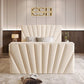 Modern bedroom with cream bed and 2025 The Chelsea TV Bed design, chandelier, textured walls, and potted plant.