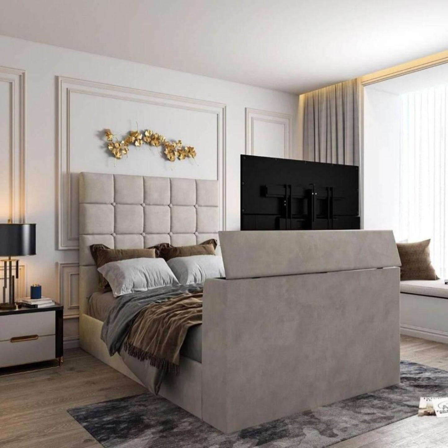 Bedroom with upholstered bed, TV in footboard, 2025 Windsor TV bed, tufted headboard, gold decor, window seat, and light walls.