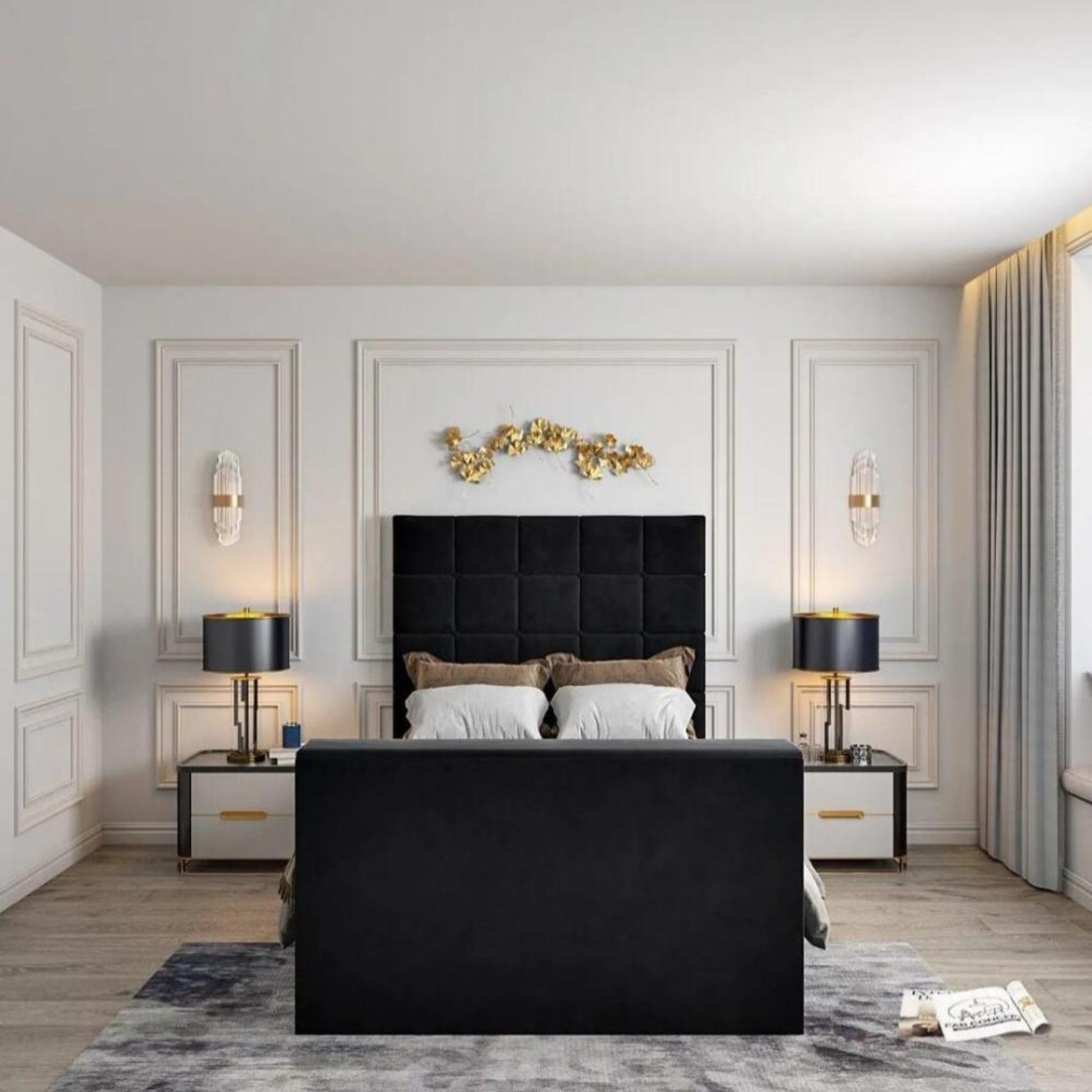 Modern bedroom with a black upholstered bed, 2025 Windsor TV bed, gold wall decor, and elegant lighting on white walls.
