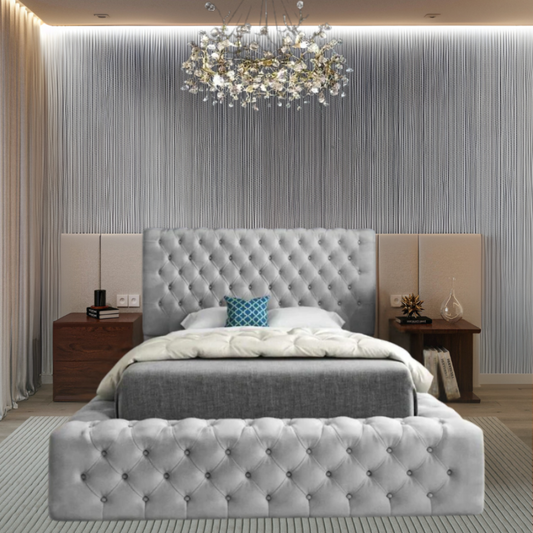Modern bedroom with tufted gray bed, chandelier, and textured gray wall.