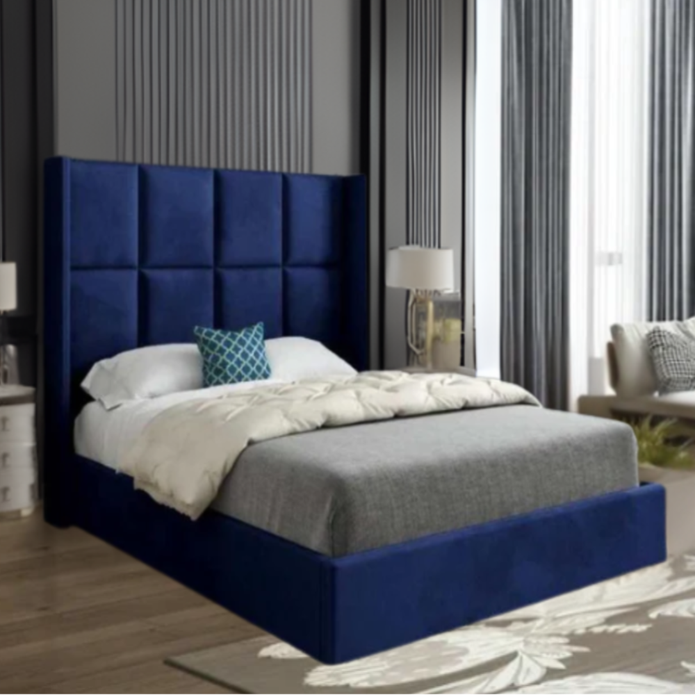 Modern bedroom with a dark blue upholstered bed and tufted headboard.