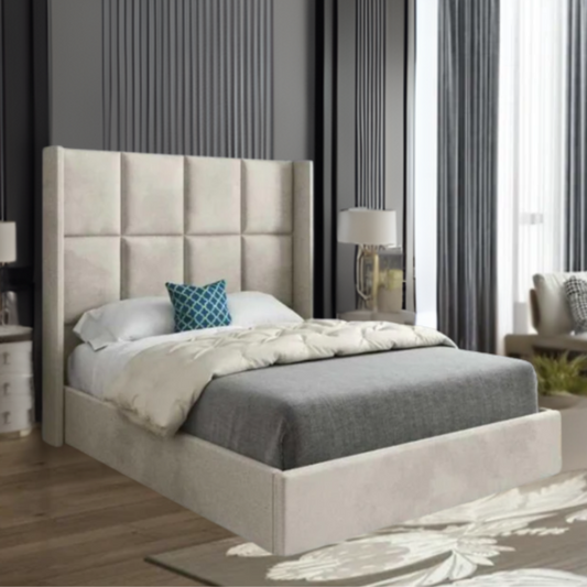 A modern bedroom with a tall, upholstered headboard and a teal decorative pillow on the bed.