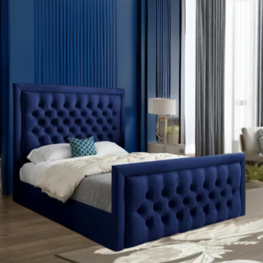 Modern bedroom with a deep blue tufted bed and accenting decor.