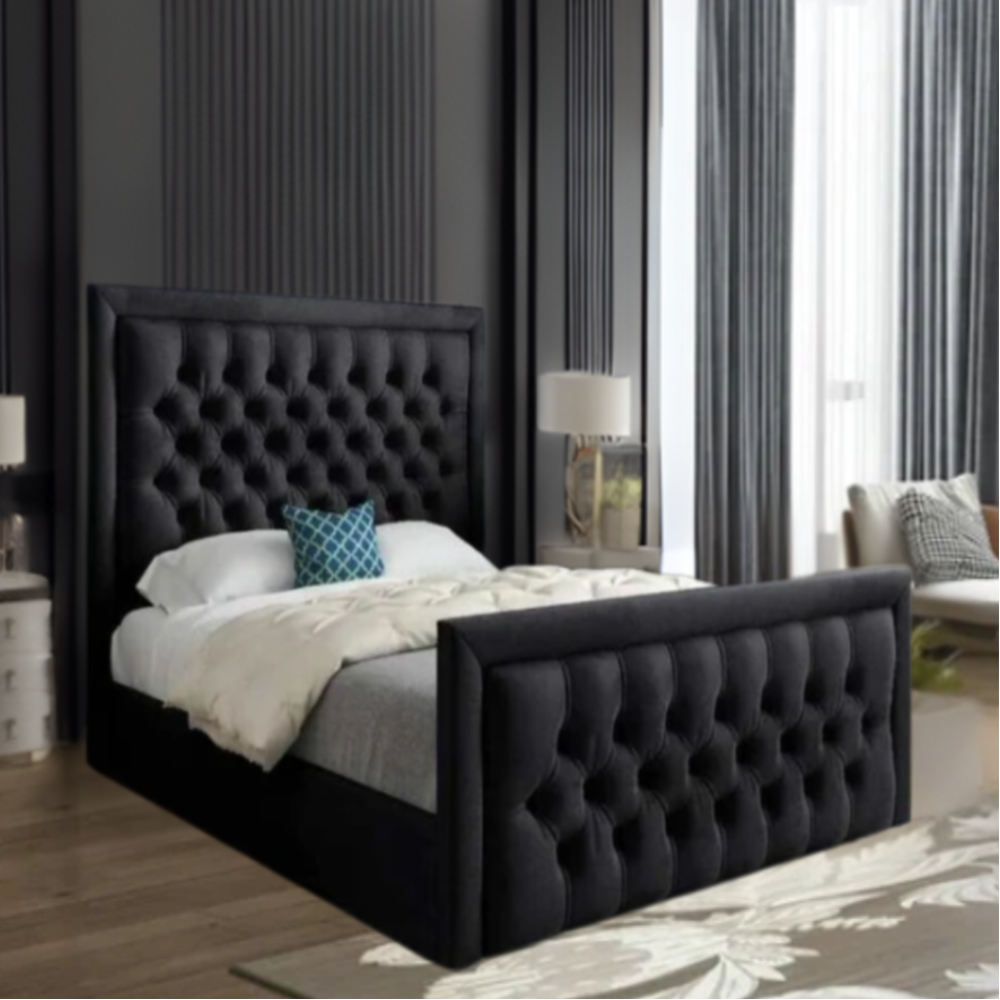 Bedroom with a black tufted bed, white and gray bedding, and a blue pillow.