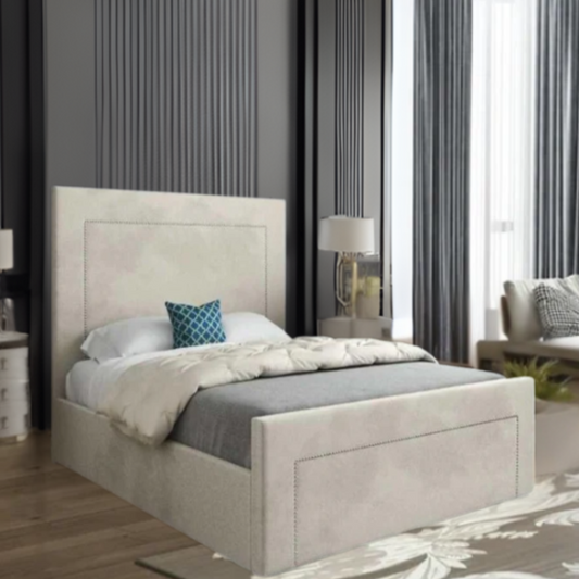 Modern bedroom with upholstered bed, beige headboard, and blue accent pillow.